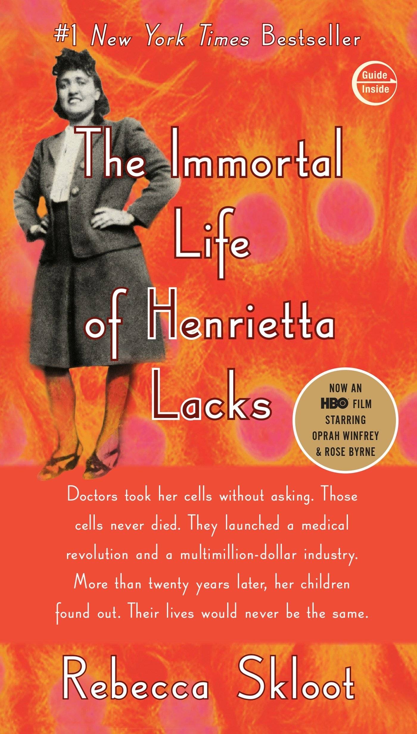 Orange book cover with a black and white photo of Henrietta Lacks standing with her hands on her hips